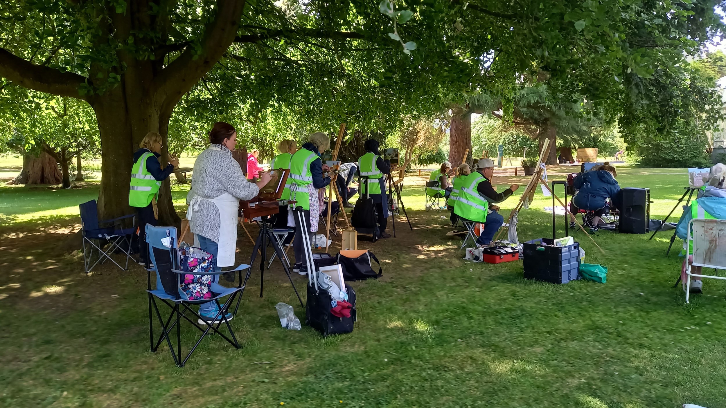 Artists painting beneath tree in Farmleigh Estate